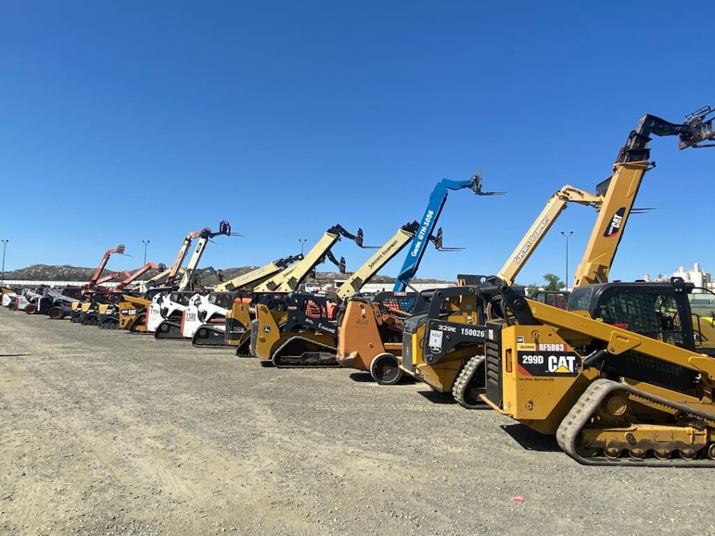 Heavy equipment in a dealership yard, representing equipment dealer financing for business customers.